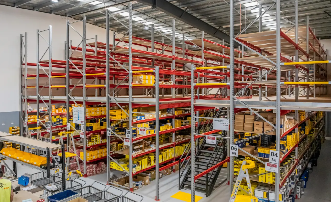 Rack-supported mezzanine floor built on pallet racking system for maximising vertical warehouse space